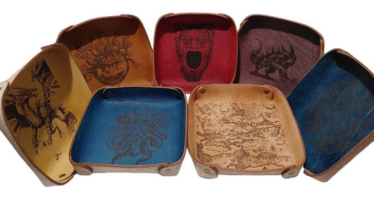 Fantasy Dice Tray Made of Vegetable Tanned Leather, hand-dyed a Medium Brown. Logo is Laser Engraved. 7″ x 7″ *Includes a standard set of 7 dice.