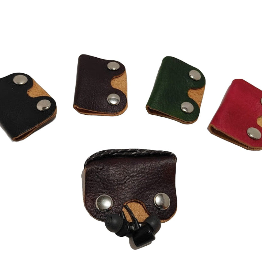 Earphone Holder Designed to hold most corded earphones on the market. Hand-crafted in a variety of leathers we have in stock including: Hand-Dyed Vegtan, Milled Vegtan and Pull-up Oiltan Leather.