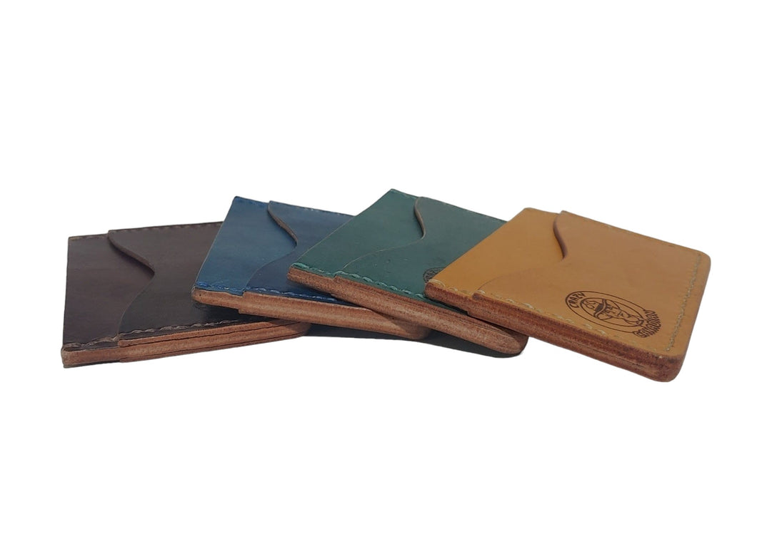 Minimalist Card Wallet - Hand-Dyed Made from Hand-dyed Vegtan Leather Designed to carry just your most important bank cards, credit cards and ID. Features 2 outside pockets, and one interior pocket. All hand-stitched.