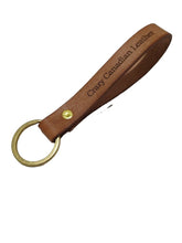 Load image into Gallery viewer, Crazy Canadian Key Strap Made of High Quality Belt and Veg Tan Leathers 3/4&quot; wide x 5 1/2&quot; long. Currently Available in 9 colors; Natural, Tan, Turquoise, Ocean Blue, Mauve, Purple, Red, Brown and Black.

