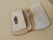 Load image into Gallery viewer, Hipster Wallet  Hand Crafted in Vegtable Tanned Leather.  Currently one piece available, more coming soon!  Medium Brown Exterior, Natural Interior  Features main cash pocket, coin pouch and 4 card pockets.
