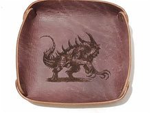 Load image into Gallery viewer, Fantasy Dice Tray  Made of Vegetable Tanned Leather, hand-dyed a Medium Brown.  Logo is Laser Engraved. 7″ x 7″  *Includes a standard set of 7 dice.
